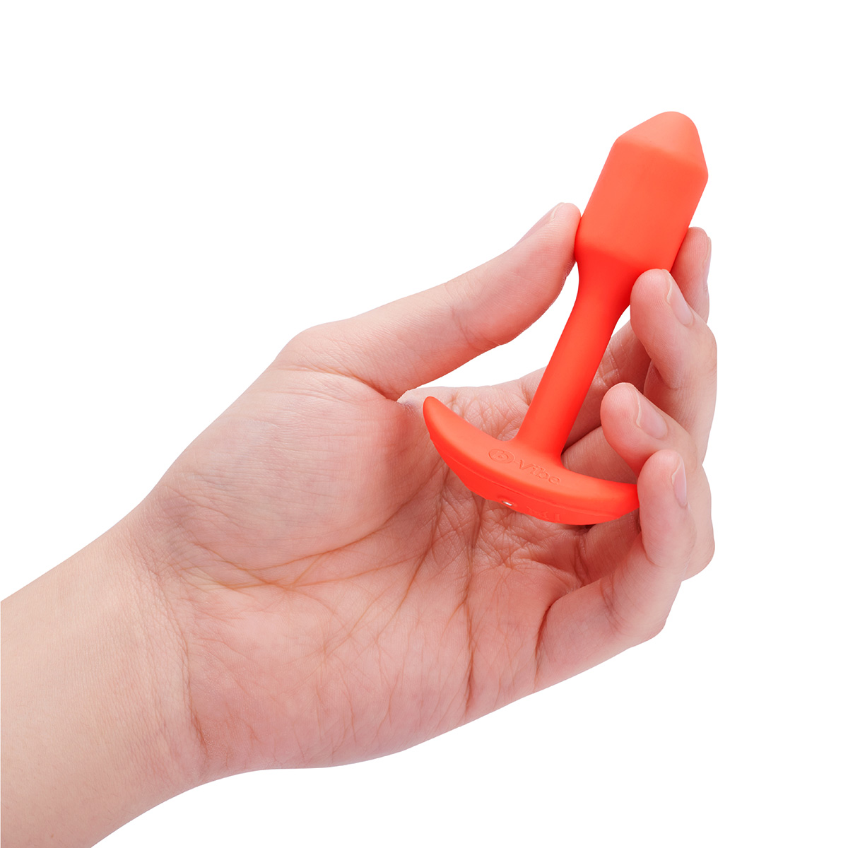 b-Vibe Профессиональная пробка для ношения с вибрацией оранжевая b-Vibe Vibrating Snug Plug 1